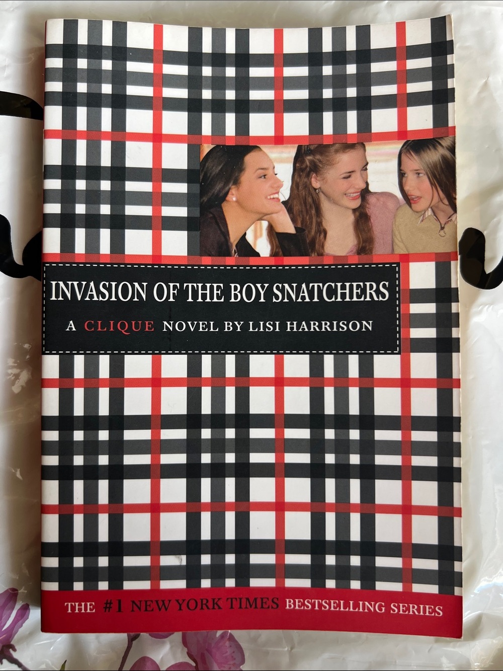 Paper Back book“Invasion of the Boy Snatchers “by Lisi Harrison